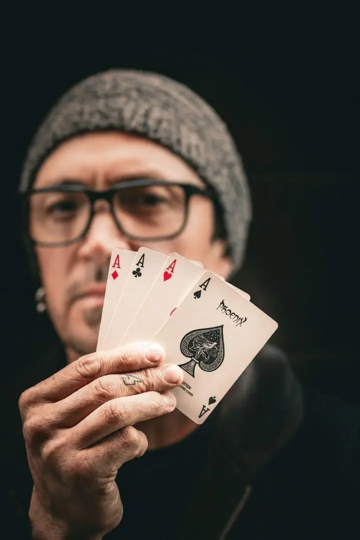 Tripp fanning the four aces toward the camera