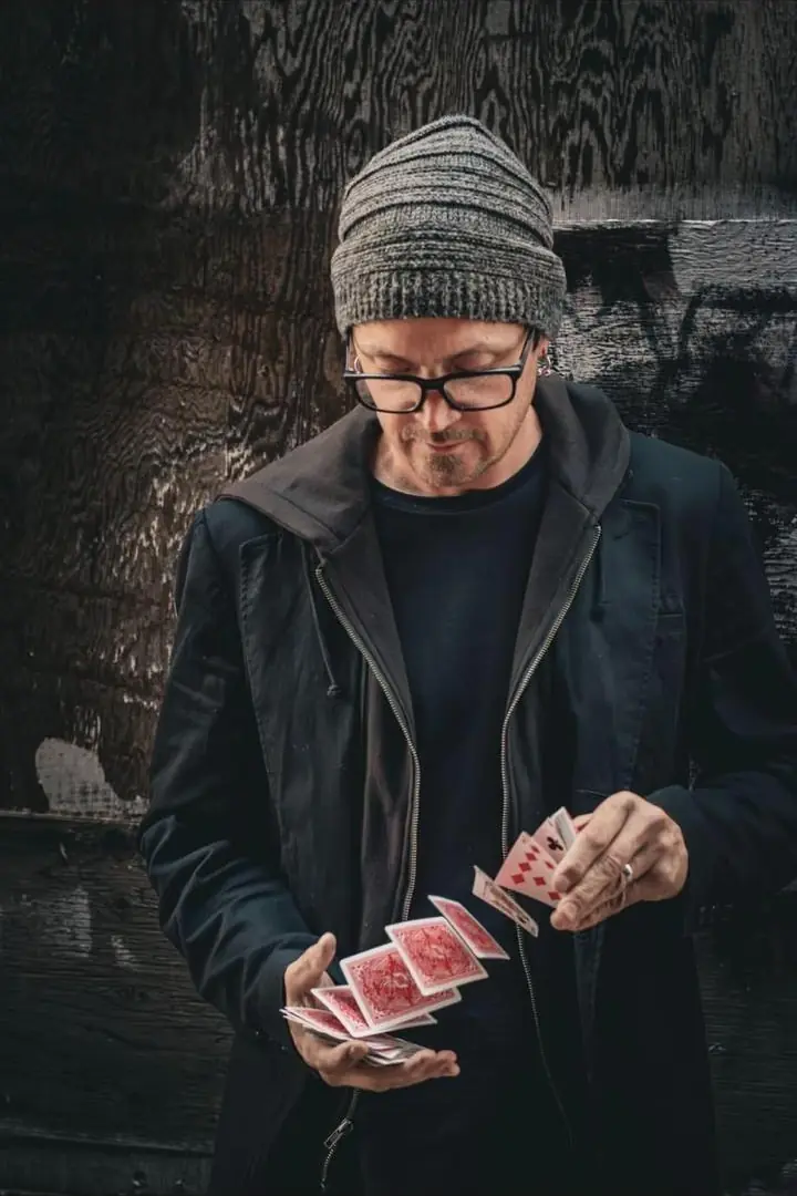 Tripp springing cards from one hand to the other